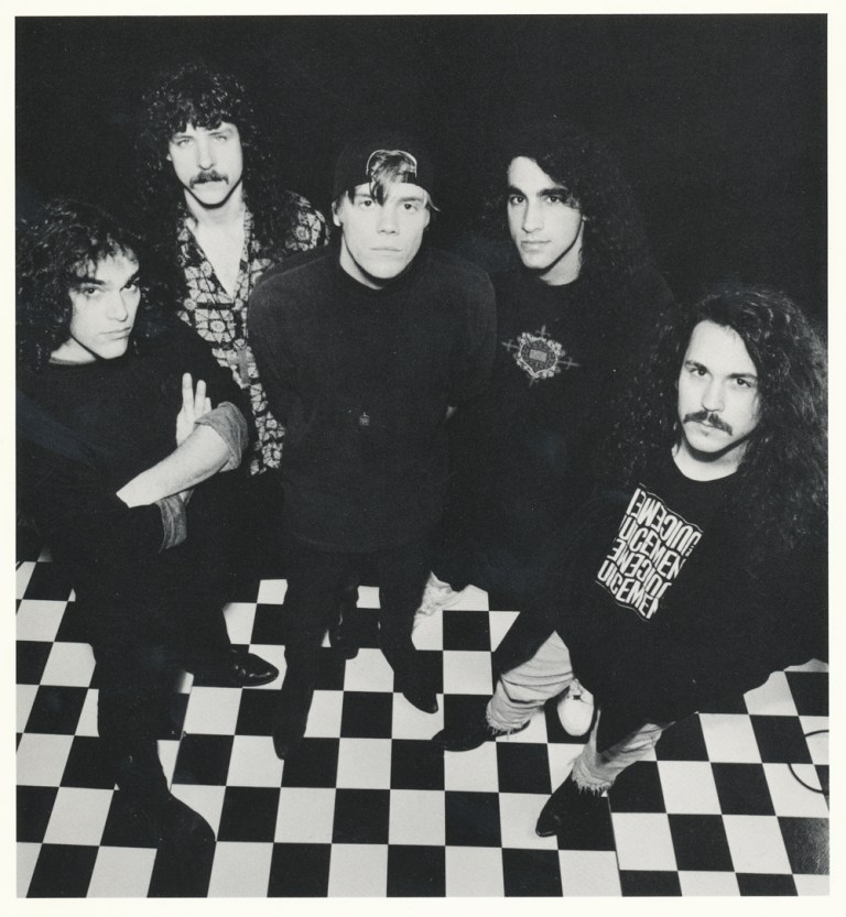 The Juicemen standing on a checkered floor
